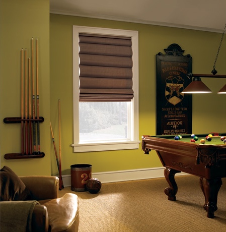 Roman shades in Cleveland pool room with green walls.